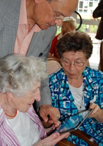 Seniors using a tablet.